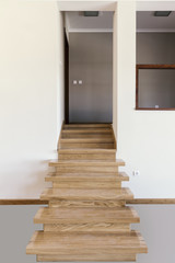 wooden stairs in room