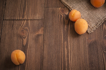 Delicious ripe apricots on a wooden background. Horizontal top view