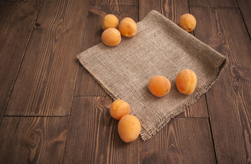 Delicious ripe apricots on a wooden background. Horizontal top view