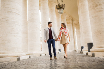 Fototapeta na wymiar Happy loving couple, man and woman traveling on holiday in Rome, Italy