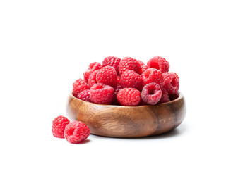 Fresh  selected raspberries on wooden bowl isolated on white © lena_zajchikova
