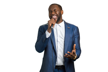 Afroamerican singer perfoming in studio. Professional vocalist perfoming. Black man is singing on...