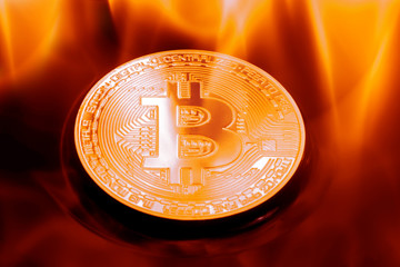Coin physical Gold bitcoin in a violent fire.