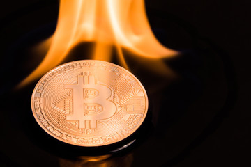Bitcoin burns with a yellow flame.