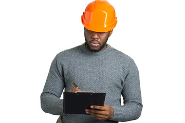 Serious engineer writing on clipboard. Building inspector writing on black clipboard isolated on...