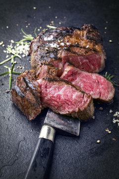 Barbecue dry aged wagyu rib eye steak as close-up on slate