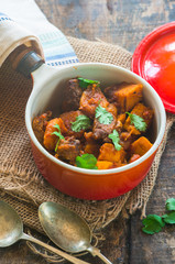 Maroccan lamb tajine garnished with fresh coriander leaves