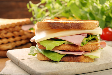 Fresh sandwich on wooden background
