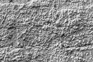 White concrete wall with natural texture and cracks on the surface as background