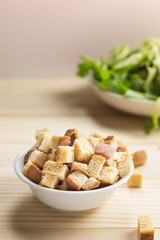 homemade croutons in white ceramic bowl
