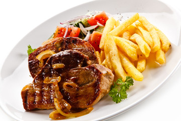 Grilled beefsteak with french fries on white background 