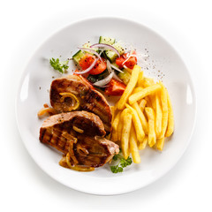 Grilled beefsteak with french fries on white background 