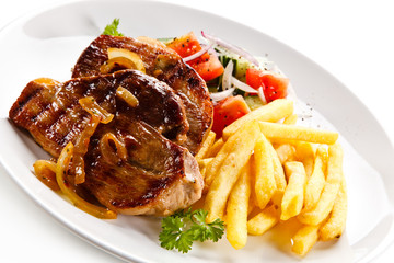 Grilled beefsteak with french fries on white background 