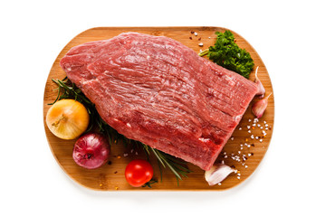 Fresh raw beef sirloin on cutting board on white background 