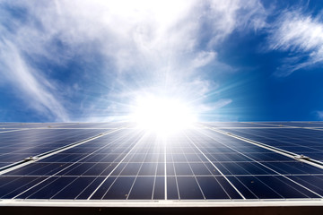 solar cell panel on roof house with strong sun and sky