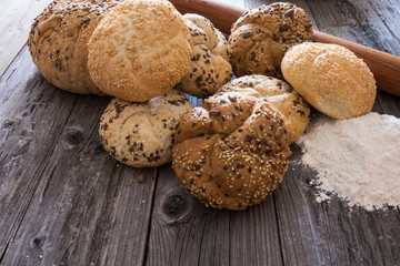 Many mixed breads ,on rustic wooden background
