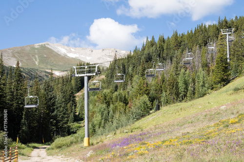 Chair Lift And A Mountain Peak In Beautiful Summertime