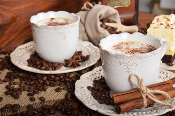 Obraz na płótnie Canvas coffee with chocolate and cacao chocolate cake and a bag of coffee beans