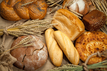 Bread assortment on background of the old canvas