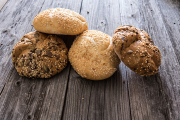 Many mixed breads ,on rustic wooden background