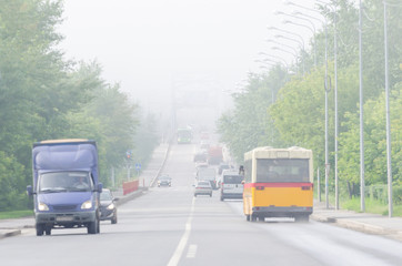 View of the city road in the fog weather poor visibility