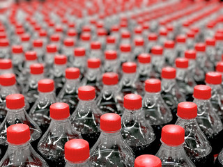 Plastic bottles with soda in the store