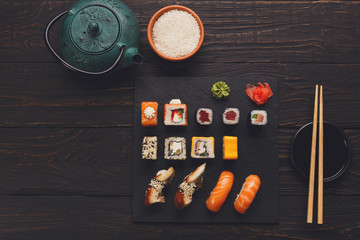 Sushi and rolls top view in japanese restaurant