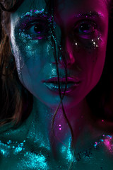 girl with the vanguard shining make-up with spangles and moisture