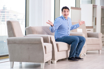 Young man shopping in furniture store