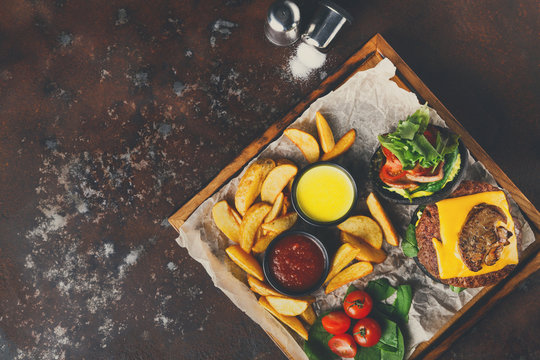Take away burger menu on wooden tray top view