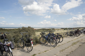 Fototapeta premium Bicyles parked on the top of the dune