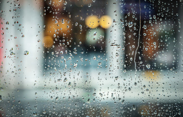 water drops on window with blurred light background, Rain drops on glass