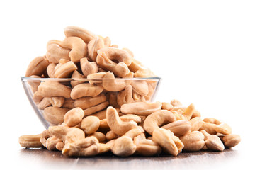 Bowl with cashew nuts isolated on white