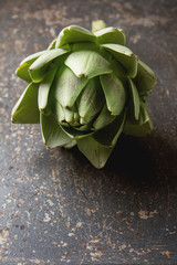 Baby Ripe Organic Artichokes on the rustic background