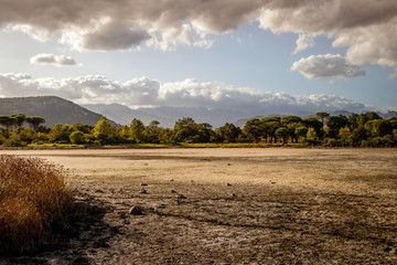 Dried out lake Padulu Tortu on the island of Corsica. In the background you can see the Aiguilles...