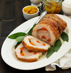 Fried pork loin stuffed with carrots and garlic. Festive dish.