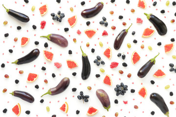 Food collage of fresh vegetables, top view. Grapefruit slices, eggplant, blackberry, green and black grapes, isolated on white background. Abstract composition of food. Concept of healthy eating.