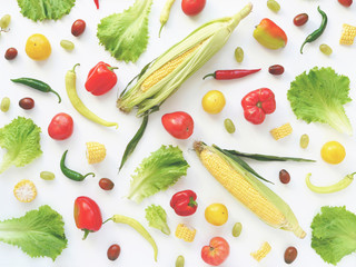 Food collage of fresh vegetables, top view. Corn in the cob, pepper, lettuce leaves, tomato isolated on white background. Abstract composition of vegetables. Сoncept of healthy eating. Food pattern.