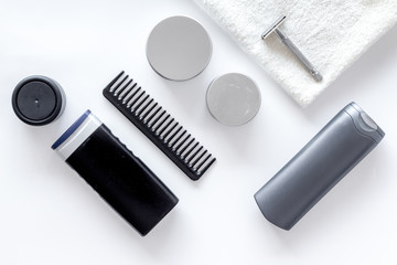 Cosmetics for men's hair on white background top view