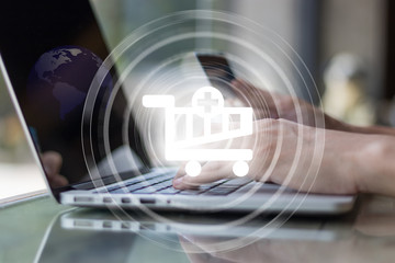 Hand holding credit card for online shopping on laptop ecommerce concept