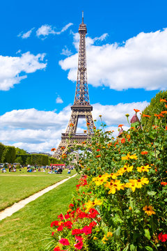 The Eiffel Tower and flowers on a beautiful summer day in Paris