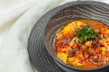 Plate of vegetable soup with meat