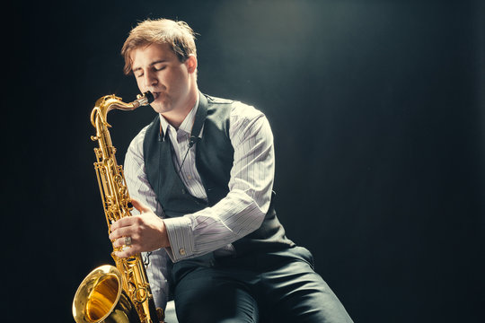 Young Man Playing The Saxophone