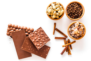 Ingredients for chocolates on white background top view