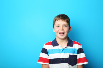 Portrait of young boy on blue background