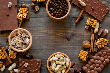 Mockup with chocolate on dark wooden background top view