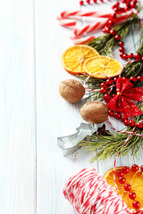 Christmas tree branch with dried oranges, anise star on wooden table