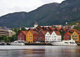 Fototapeta premium Waterfront with historical buildings, and mountains on the background, Bergen, Norway.