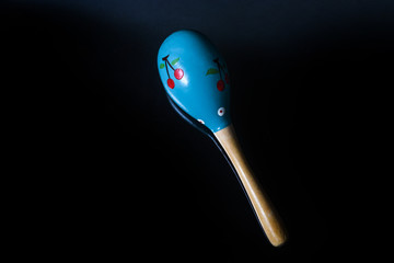 maracas on a black background