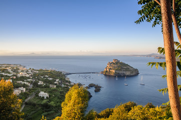 Aerial scenic view on Aragonese fortress at sunset, Ischia, Italy